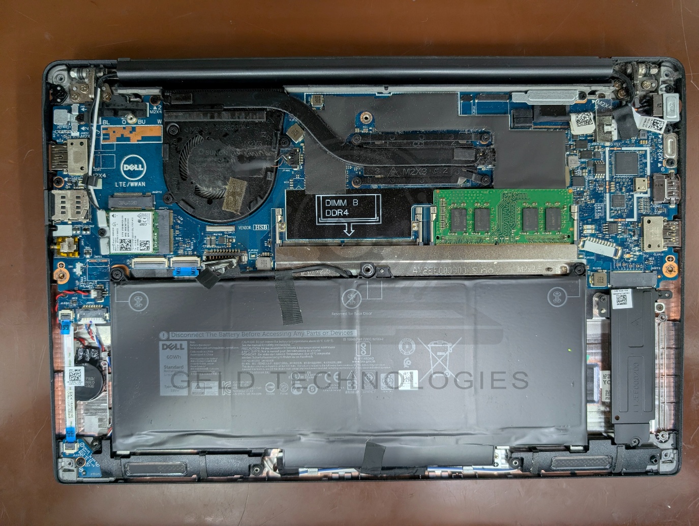 Dell Latitude 7400 opened chassis showing internal components after water damage