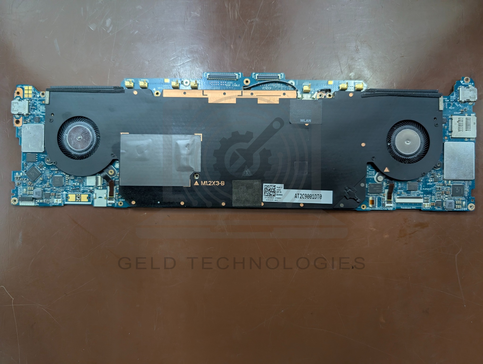 Dell XPS 13 7390 2-in-1 motherboard assembly with replacement cooling fans installed