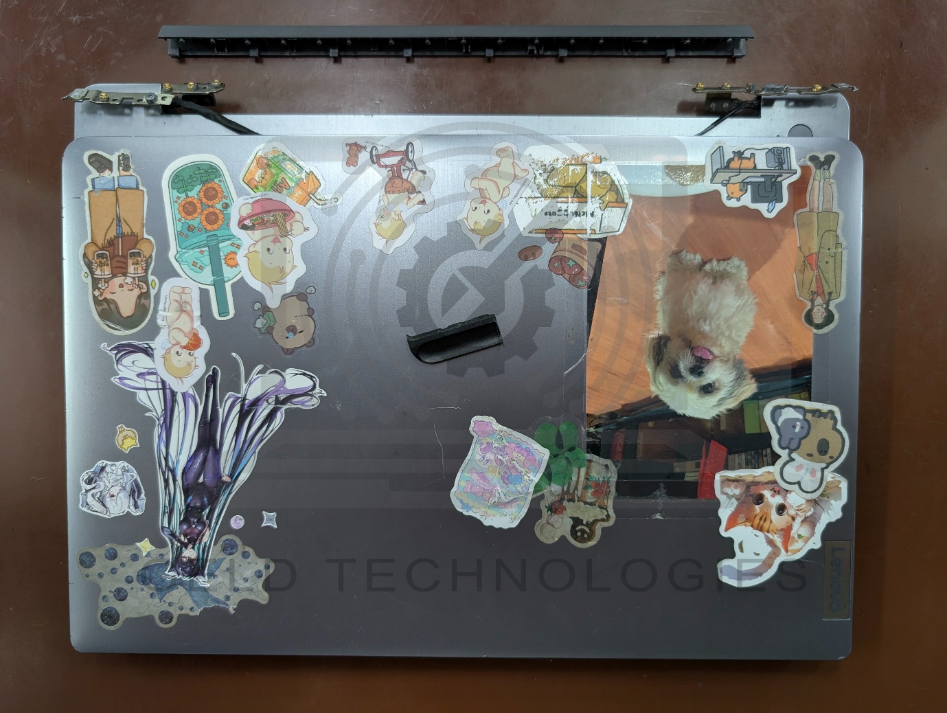 Lenovo IdeaPad 3 lid showing hinges separated from the laptop base before hinge rebuild